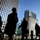 Office workers and commuters walking through Canary Wharf in London, as almost half of employees have had their accent mocked, criticised or singled out in a social setting. Picture: Victoria Jones/PA Wire