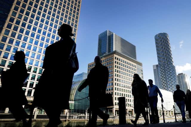Office workers and commuters walking through Canary Wharf in London, as almost half of employees have had their accent mocked, criticised or singled out in a social setting. Picture: Victoria Jones/PA Wire