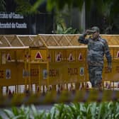 An Indian paramilitary soldier stands guard next to a police barricade outside the Canadian High Commission in New Delhi, India. Tensions between India and Canada are high after Prime Minister Justin Trudeau's government expelled a top Indian diplomat and accused India of having links to the assassination in Canada of Sikh leader Hardeep Singh Nijjar, a strong supporter of an independent Sikh homeland.