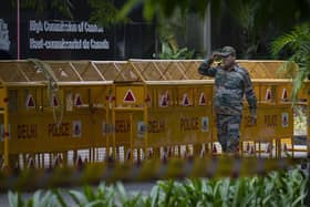 An Indian paramilitary soldier stands guard next to a police barricade outside the Canadian High Commission in New Delhi, India. Tensions between India and Canada are high after Prime Minister Justin Trudeau's government expelled a top Indian diplomat and accused India of having links to the assassination in Canada of Sikh leader Hardeep Singh Nijjar, a strong supporter of an independent Sikh homeland.