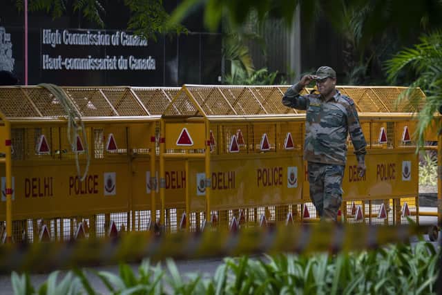 An Indian paramilitary soldier stands guard next to a police barricade outside the Canadian High Commission in New Delhi, India. Tensions between India and Canada are high after Prime Minister Justin Trudeau's government expelled a top Indian diplomat and accused India of having links to the assassination in Canada of Sikh leader Hardeep Singh Nijjar, a strong supporter of an independent Sikh homeland.