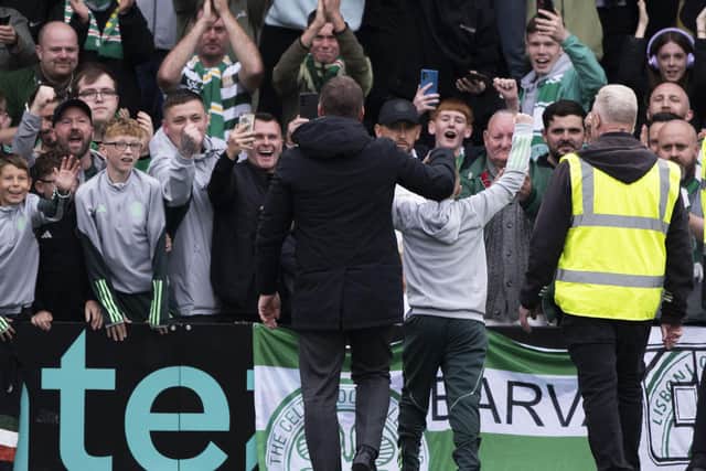 Celtic manager Brendan Rodgers with the young fan he rescued from the clutches of stewards after the 3-0 win at Livingston. (Photo by Paul Devlin / SNS Group)