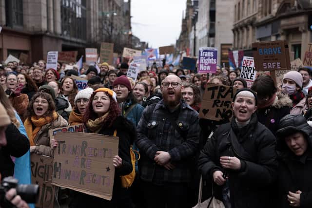 Trans rights demonstrators attend a rally in Glasgow after Rishi Sunak announced that the UK government will use a Section 35 order to block Scotland's recent Gender Recognition Reform Bill.