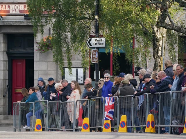 Members of the public line the streets  (Pic: PA/Andrew Milligan)