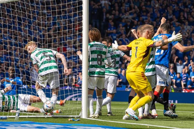 Hart claims for a foul after Rangers' goal - which was given by VAR.