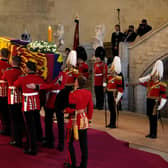 The Coffin of Queen Elizabeth II is carried into The Palace of Westminster during the procession for the Lying-in State of Queen Elizabeth II in London