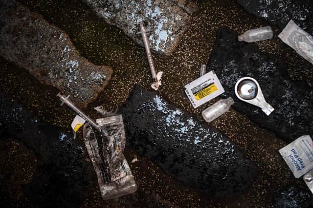 Evidence of drug use, like this discarded paraphernalia in a lane in Glasgow, pictured yesterday, is not hard to find (Picture: Andy Buchanan/AFP via Getty Images)