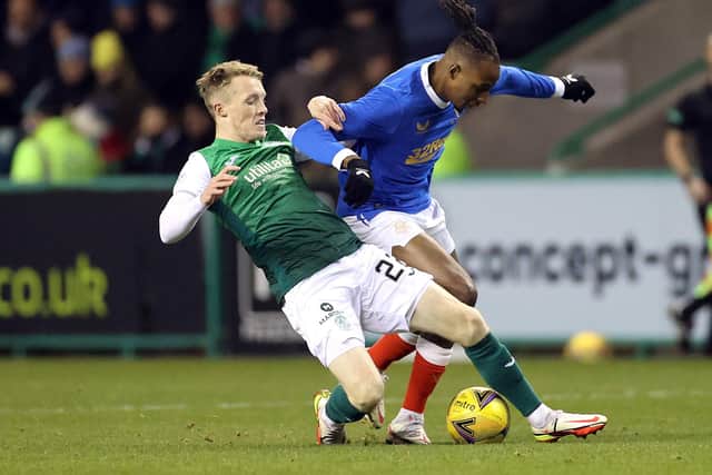 Rangers' Joe Aribo (right) and Hibernian's Jake Doyle-Hayes battle for the ball. (Credit: Steve Welsh/PA Wire)
