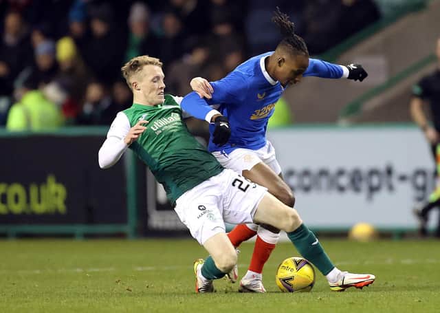 Rangers' Joe Aribo (right) and Hibernian's Jake Doyle-Hayes battle for the ball. (Credit: Steve Welsh/PA Wire)