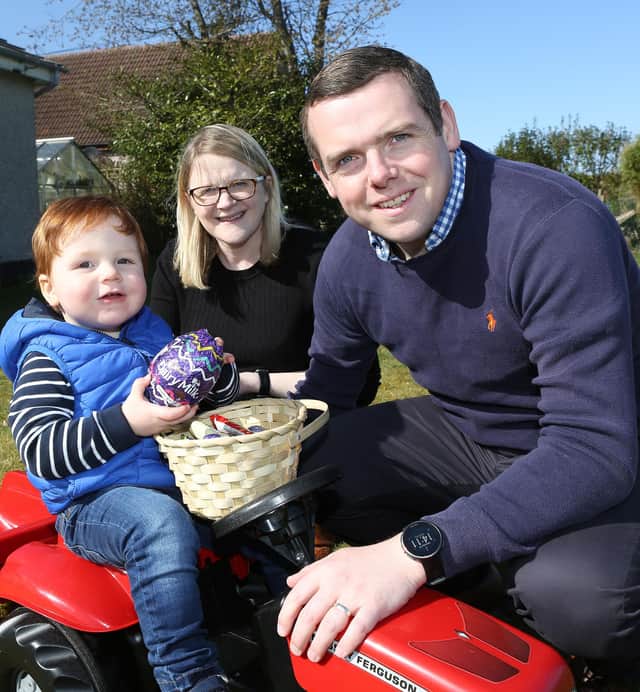 Douglas Ross, his wife Krystle and their son Alistair.