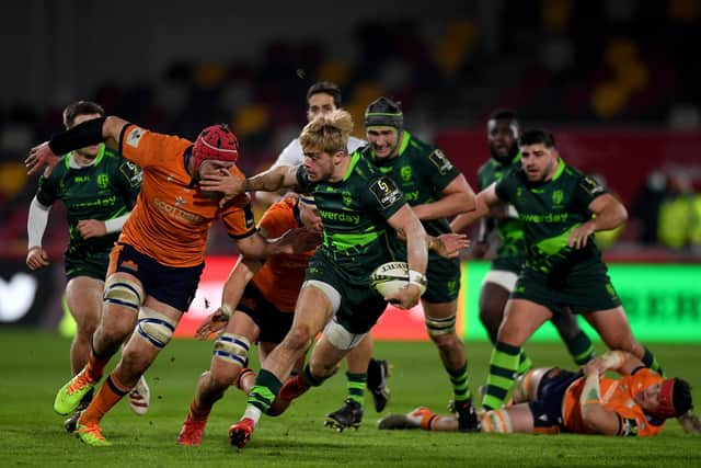 Ollie Hassell-Collins of London Irish tries to break clear of the Edinburgh defence.