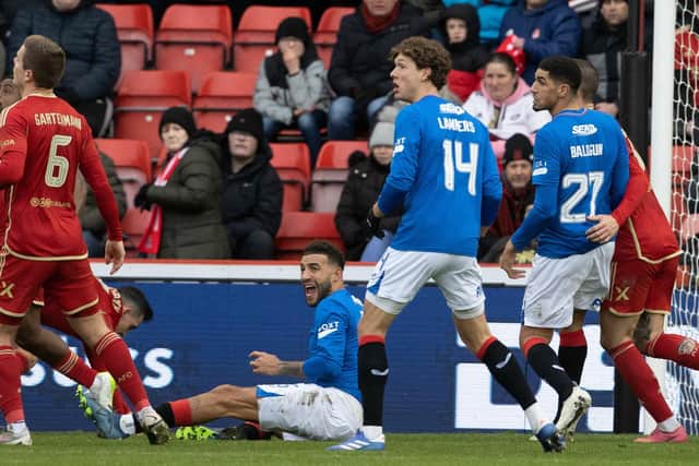 Rangers defender Connor Goldson goes down in the Aberdeen box after having his shirt pulled before being awarded a penalty following a VAR check. (Photo by Alan Harvey / SNS Group)