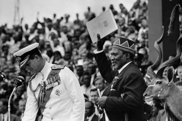 Nairobi, 13 December, 1963: Jomo Kenyatta, leader of the Kenya African National Union (KANU), holds the official document of Kenyan independence as he becomes President of Kenya. To his right is the Duke of Edinburgh, representing Queen Elisabeth for the ceremonies. PIC: AFP via Getty Images