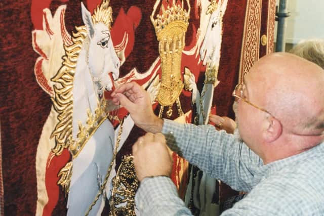 Malcom working on the huge hanging in the Great Hall at Stirling Castle