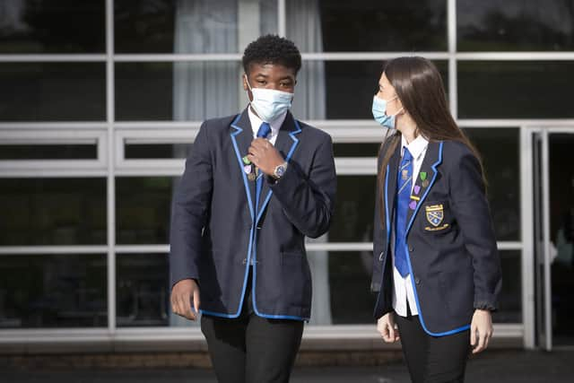 Head boy Jordy Yahve and head girl Orla Irvine head for lessons at St Andrew's RC Secondary School in Glasgow as more pupils are returning to school in Scotland in the latest phase of lockdown easing last month.