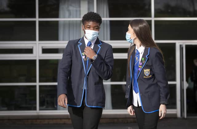 Head boy Jordy Yahve and head girl Orla Irvine head for lessons at St Andrew's RC Secondary School in Glasgow as more pupils are returning to school in Scotland in the latest phase of lockdown easing last month.