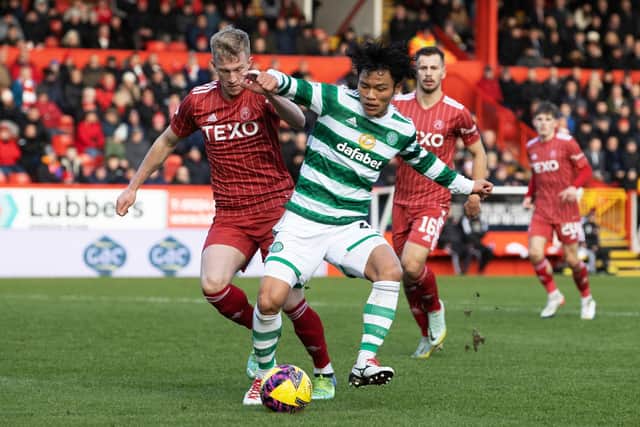 Reo Hatate and Ross McCrorie in action during a cinch Premiership match between Aberdeen and Celtic.