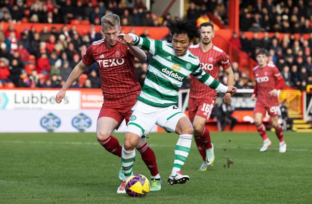 Reo Hatate and Ross McCrorie in action during a cinch Premiership match between Aberdeen and Celtic.