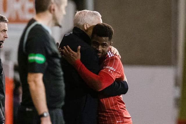 Aberdeen manager Jim Goodwin hugs Luis 'Duk' Lopes after scoring twice against St Johnstone.