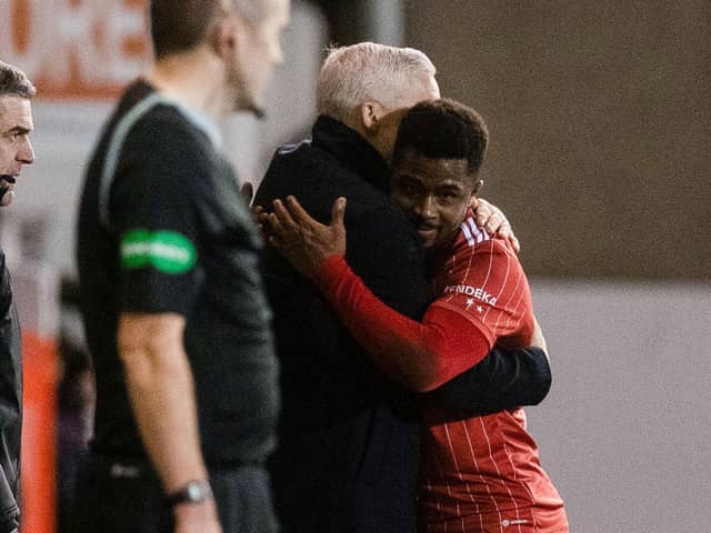 Aberdeen manager Jim Goodwin hugs Luis 'Duk' Lopes after scoring twice against St Johnstone.