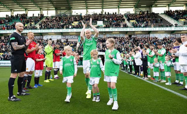 Hibs legend David Gray receives a guard of honour ahead of his testimonial match against a Manchester United Select at Easter Road. (Photo by Ross Parker / SNS Group)