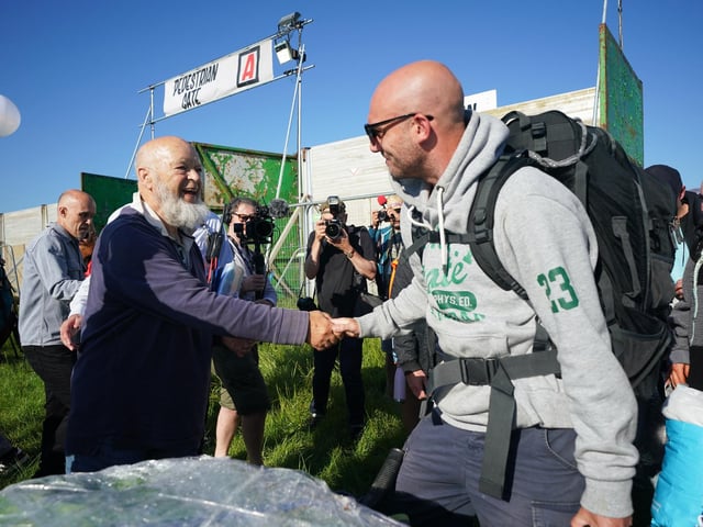 Michael Eavis (left) shakes hands with a festivalgoer at the Glastonbury Festival at Worthy Farm in Somerset. Glastonbury festival organiser Emily Eavis marked the opening of the gates with a post on Instagram, writing alongside a picture: “Gates are OPEN… Welcome everyone to Glastonbury 2022!”.