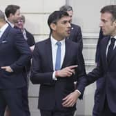 Prime Minister Rishi Sunak and President of France, Emmanuel Macron after a group picture during the first UK-France summit in five years at Elysee Palace in Paris.