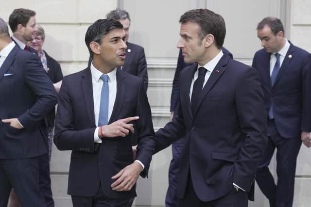 Prime Minister Rishi Sunak and President of France, Emmanuel Macron after a group picture during the first UK-France summit in five years at Elysee Palace in Paris.
