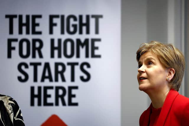 First Minister Nicola Sturgeon reacts during a visit to Shelter Scotland in Edinburgh. Picture: Jeff J Mitchell/POOL/AFP via Getty Images