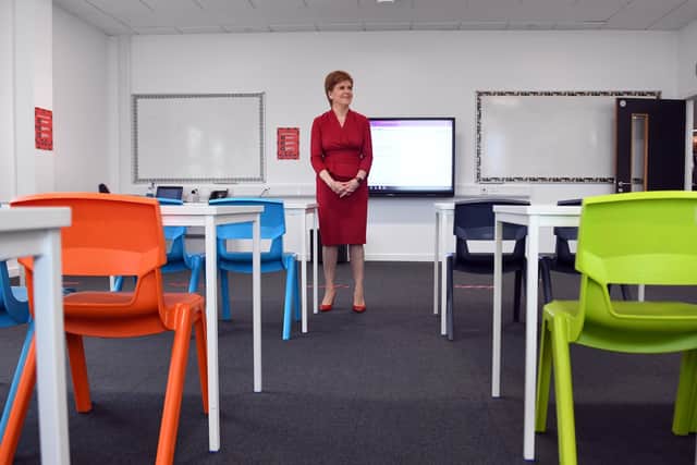 First Minister of Scotland Nicola Sturgeon views a classroom as she visits West Calder High School. Photo by Andy Buchanan / AFP via Getty