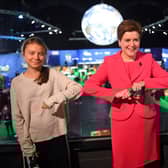 While Nicola Sturgeon was happy to pose with climate activists Vanessa Nakate, right, and Greta Thunberg at last year's COP26 summit in Glasgow, her government's actions on reducing carbon emissions have been lacking (Picture: Andy Buchanan/pool/Getty Images)