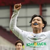 Celtic's Reo Hatate celebrates after securing the league title with victory over Hearts at Tynecastle. Photo by Ross Parker / SNS Group