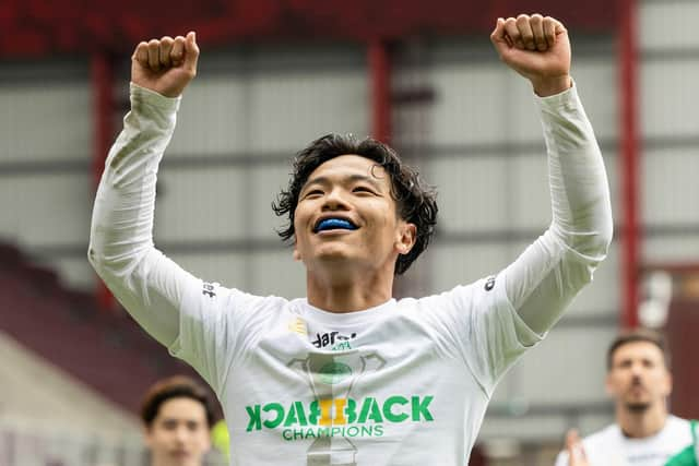 Celtic's Reo Hatate celebrates after securing the league title with victory over Hearts at Tynecastle. Photo by Ross Parker / SNS Group