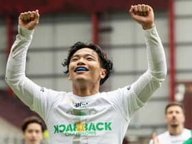 Celtic's Reo Hatate celebrates after securing the league title with victory over Hearts at Tynecastle. Photo by Ross Parker / SNS Group