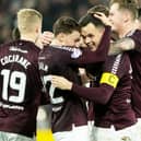 Aidan Denholm embraces Lawrence Shankland after the striker continued his rich vein of Hearts form against St Mirren.