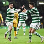 Celtic's Greg Taylor celebrates his opener against Livingston with team-mate Matt O'Riley. (Photo by Ross MacDonald / SNS Group)