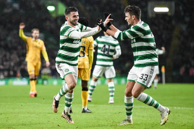 Celtic's Greg Taylor celebrates his opener against Livingston with team-mate Matt O'Riley. (Photo by Ross MacDonald / SNS Group)