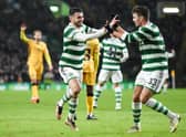 Celtic's Greg Taylor celebrates his opener against Livingston with team-mate Matt O'Riley. (Photo by Ross MacDonald / SNS Group)