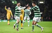 Celtic's Greg Taylor celebrates his opener against Livingston with team-mate Matt O'Riley. (Photo by Ross MacDonald / SNS Group)