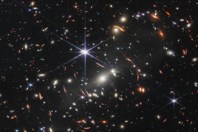 This image, known as Webb's First Deep Field, is the deepest and sharpest infrared image of the distant universe to date. It gazes back in time 4.6 billion years to a galaxy cluster called SMACS 0723, just a "tiny sliver of the vast universe".
