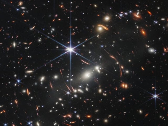 This image, known as Webb's First Deep Field, is the deepest and sharpest infrared image of the distant universe to date. It gazes back in time 4.6 billion years to a galaxy cluster called SMACS 0723, just a "tiny sliver of the vast universe".