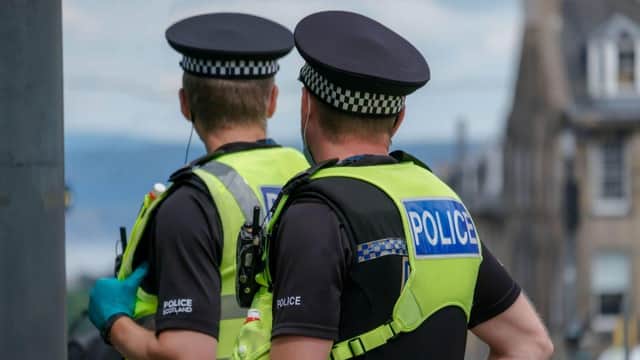Police officers are questioning two men over a double death in Edinburgh