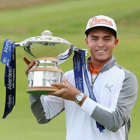 Rickie Fowler celebrates with the trophy after winning the 2015 Aberdeen Asset Management Scottish Open at Gullane. Picture: Andrew Redington/Getty Images.