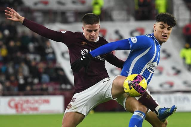 Hearts' Cammy Devlin challenges Kilmarnock's Benjamin Chrisene during the victory over the Ayrshire men at Tynecastle.