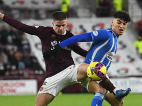 Hearts' Cammy Devlin challenges Kilmarnock's Benjamin Chrisene during the victory over the Ayrshire men at Tynecastle.