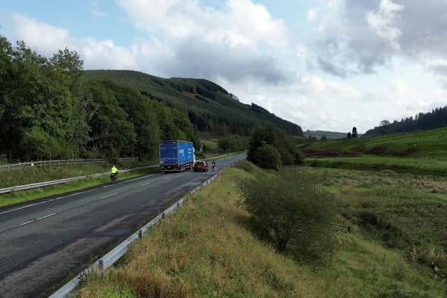 Lady Bathurst, 58, is narrowly missed by an overtaking car whilst cycling for charity. Picture: Tom Wakefield/Cotswold TV/SWNS