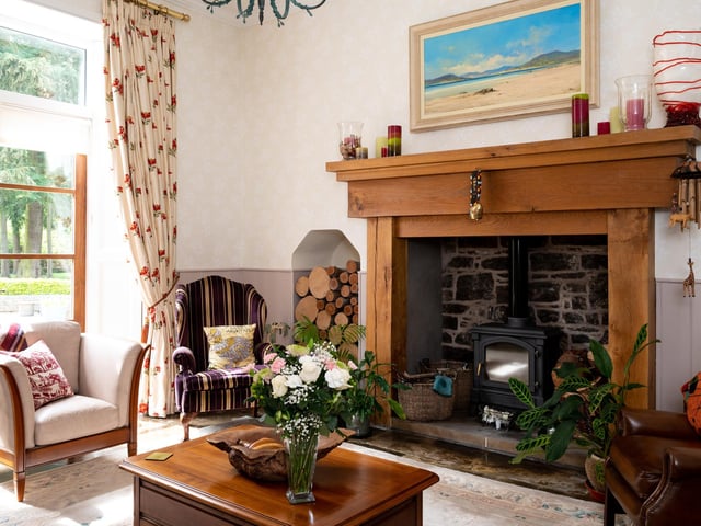 A log-burning stove ensures the room is cosy in colder months.