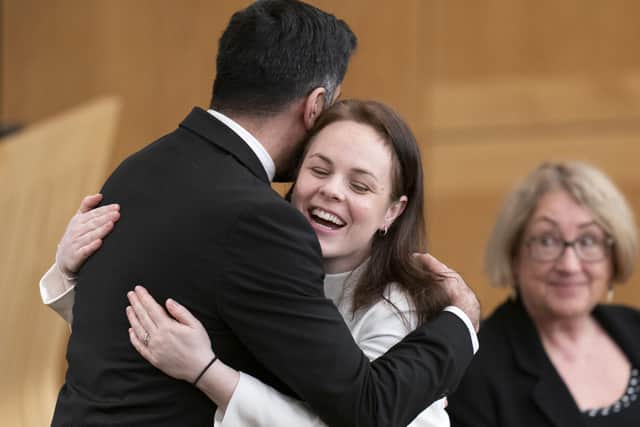 Humza Yousaf hugs Kate Forbes in the main chamber during the vote for the new First Minister