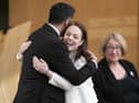 Humza Yousaf hugs Kate Forbes in the main chamber during the vote for the new First Minister