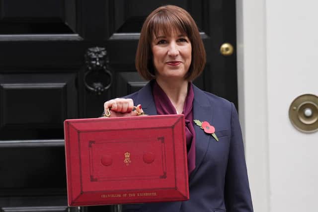 Chancellor Rachel Reeves poses outside 11 Downing Street, London, with her ministerial red box, before delivering her Budget in the Houses of Parliament. PIC: Lucy North/PA Wire